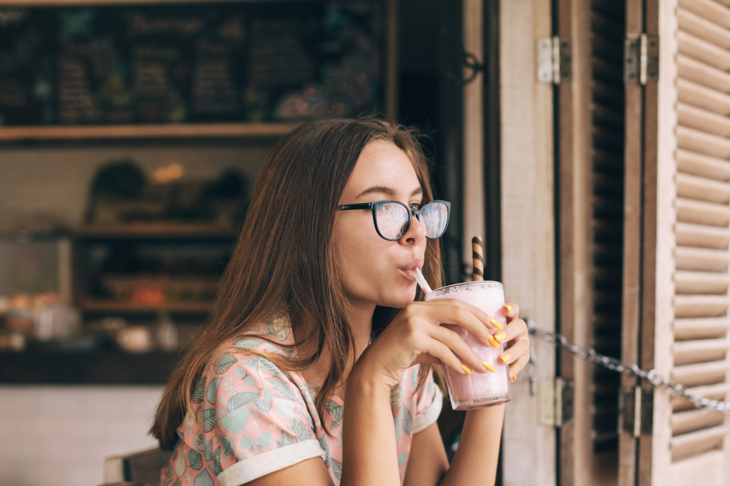 Woman drinking a milkshake